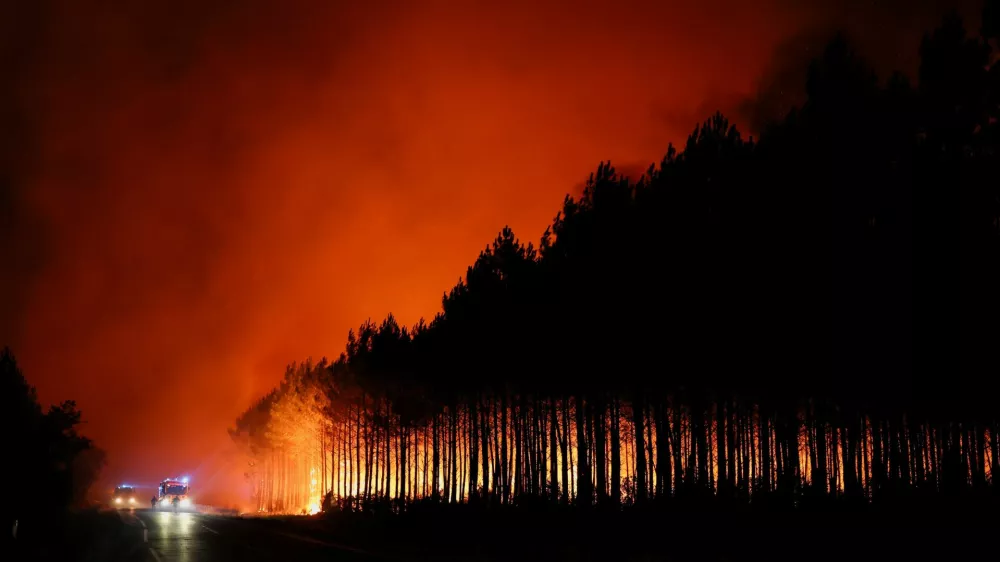 A wildfire burns in a forest area in the Gironde department amid worsening drought conditions following a heatwave and water shortages across much of France, July 22, 2026. REUTERS/Stephane Mahe