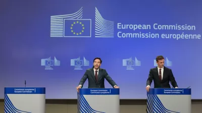 European Commission spokesman Thomas Regnier, left, speaks during a media conference regarding a fine against Google at EU headquarters in Brussels, Thursday, July 23, 2026. (AP Photo/Virginia Mayo)