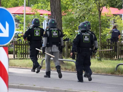 Police walks during a hostage-taking situation in a bank in Regensburg, Germany, July 23, 2026.  REUTERS/Mario Moller