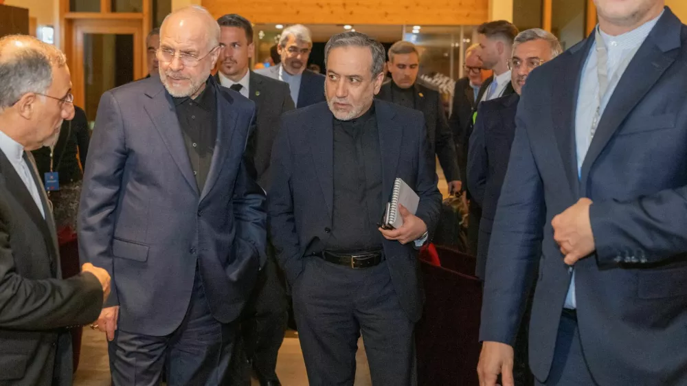 Minister of Foreign Affairs of Iran, Seyyed Abbas Araghchi, centre, and Speaker of the Islamic Parliament of Iran, Mohammad Bagher Ghalibaf, left, at the Buergenstock resort in Obbuergen, near Lucerne, Switzerland, Sunday, June 20, 2026.  URS FLUEELER/Pool via REUTERS
