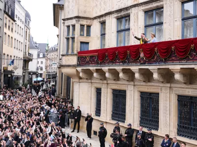 Luxembourg's Grand Duke Guillaume and Luxembourg's Grand Duchess Stephanie wave from the balcony of the Grand Ducal Palace in Luxembourg, Friday, Oct. 3, 2025. (AP Photo/Omar Havana)