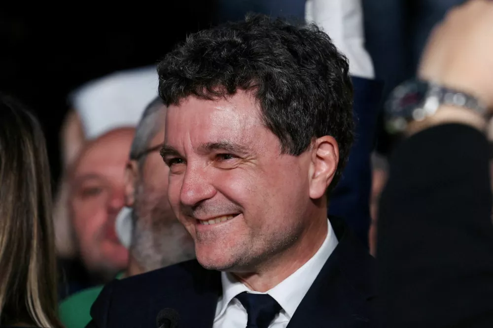 Presidential candidate Nicusor Dan reacts to first exit polls of Romania's second round of the presidential election, in Bucharest, Romania, May 18, 2025. REUTERS/Stoyan Nenov   TPX IMAGES OF THE DAY