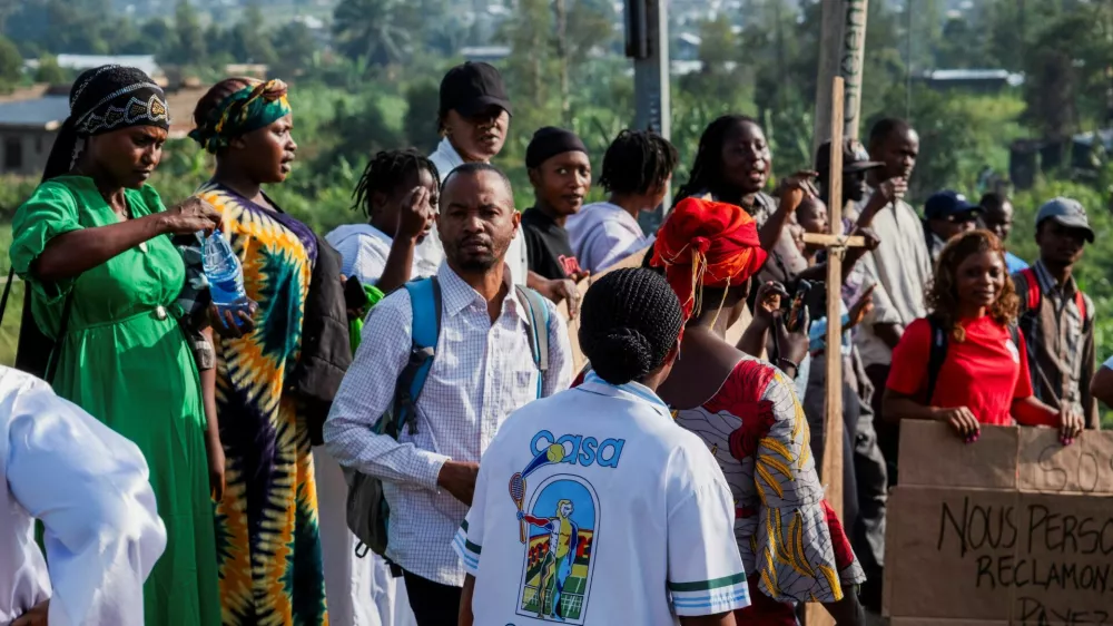 Healthcare workers demonstrate outside the Elikya Ebola Treatment Center to demand payment of two months of back benefits during a mobilization after a visit by Democratic Republic of Congo Prime Minister Judith Suminwa Tuluka, as authorities intensify efforts to contain the Ebola outbreak involving the Bundibugyo strain, in Bunia, Democratic Republic of Congo, July 25, 2026. REUTERS/Gradel Muyisa Mumbere