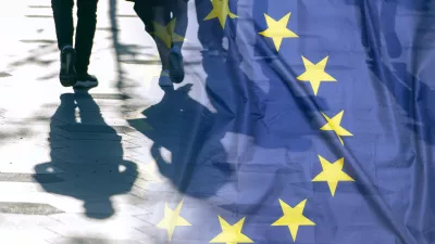 EU or European Union Flag and shadows of people, concept political picture