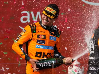 McLaren driver Lando Norris of Britain celebrates after winning the Formula One Hungarian Grand Prix auto race, at the Hungaroring racetrack in Mogyorod, near Budapest, Hungary, Sunday, July 26, 2026. (AP Photo/Darko Bandic)
