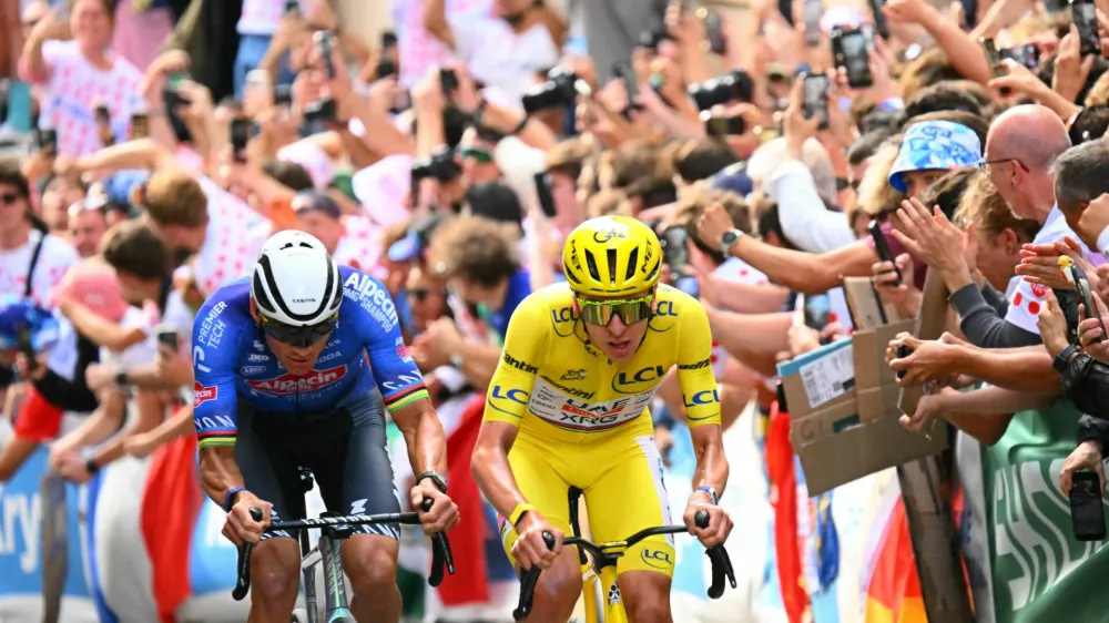 Cycling - Tour de France - Stage 21 - Paris, France - July 26, 2026 UAE Team Emirates XRG's Tadej Pogacar wearing the yellow jersey in action during stage 21 Pool via REUTERS/Garnier Etienne