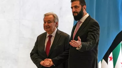 Syrian President Ahmad al-Sharaa, right, welcomes United Nations Secretary General Antonio Guterres at the Syrian presidential palace in Damascus, Syria, Saturday, July 25, 2026. (AP Photo/Omar Albam)
