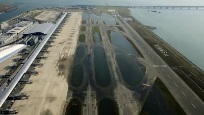 An aerial view shows a flooded runway at Kansai airport, which is built on a man-made island in a bay, after Typhoon Jebi hit the area, in Izumisano, western Japan, in this photo taken by Kyodo September 5, 2018. Mandatory credit Kyodo/via REUTERS ATTENTION EDITORS - THIS IMAGE WAS PROVIDED BY A THIRD PARTY. MANDATORY CREDIT. JAPAN OUT. NO COMMERCIAL OR EDITORIAL SALES IN JAPAN.