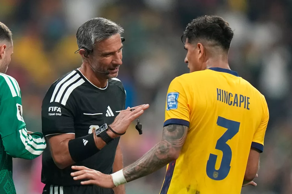 Referee Slavko Vincic, of Slovenia, talks to Ecuador's Piero Hincapie (3) during the World Cup round of 32 soccer match between Mexico and Ecuador in Mexico City, Tuesday, June 30, 2026. (AP Photo/Fernando Llano)