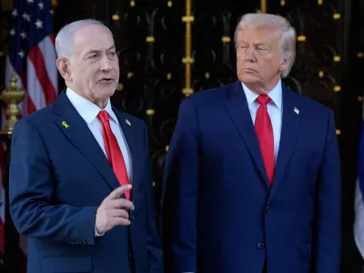 FILE - President Donald Trump listens as Israel's Prime Minister Benjamin Netanyahu speaks at President Donald Trump's Mar-a-Lago club, Dec. 29, 2025, in Palm Beach, Fla. (AP Photo/Alex Brandon, File)
