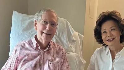 U.S. Senator Mitch McConnell (R-KY) sits with his wife, former United States secretary of labor Elaine Chao, while holding what appears to be the July 12 sports section of the Washington Post in a photograph released by his office in Washington, D.C., U.S. July 12, 2026. Office of Senator Mitch McConnell/Handout via REUTERS.  THIS IMAGE HAS BEEN SUPPLIED BY A THIRD PARTY