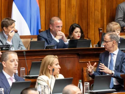 Serbia's Prime Minister Djuro Macut speaks with Ana Brnabic, President of the National Assembly of Serbia, during a parliamentary session ahead of a no-confidence vote against the government triggered by the opposition, in Belgrade, Serbia, July 27, 2026. REUTERS/Djordje Kojadinovic