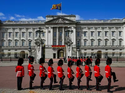 FILE PHOTO: Members of the Household Division march in front of the Buckingham Palace during the Trooping the Colour parade to honour Britain's King Charles, as part of the official birthday celebrations, in London, Britain, June 13, 2026. REUTERS/Chris J. Ratcliffe/File Photo