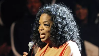 In this Friday, June 8, 2012, photo provided by TDJ Enterprise/Front Page Firm, Oprah Winfrey appears onstage at TD Jakes 35th anniversary of ministry at the Winspear Opera House in Dallas. (AP Photo/TDJ Enterprise/Front Page Firm, Vernon Bryant)
