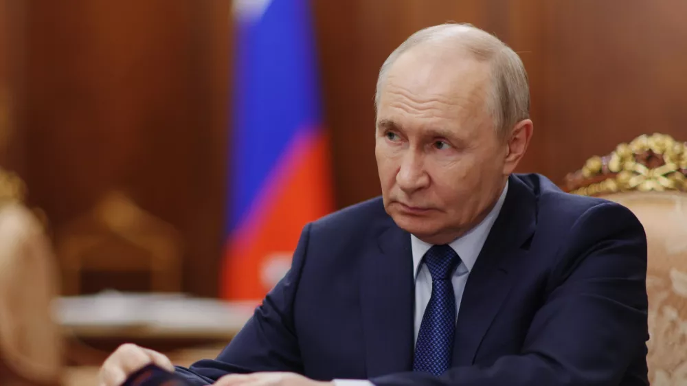 Russian President Vladimir Putin attends a meeting with Deputy Prime Minister - Presidential Envoy to the Far Eastern Federal District Yury Trutnev at the Kremlin in Moscow, Thursday, Aug. 6, 2026. (Alexander Kazakov, Sputnik, Kremlin Pool Photo via AP)