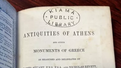 In this photo provided by Catherine Taylor a page of the book "Antiquities of Athens," stamped by a library, is shown on Thursday, July 30, 2026, after its return in Kiama, Australia, an estimated 150 years late. (Catherine Taylor via AP)