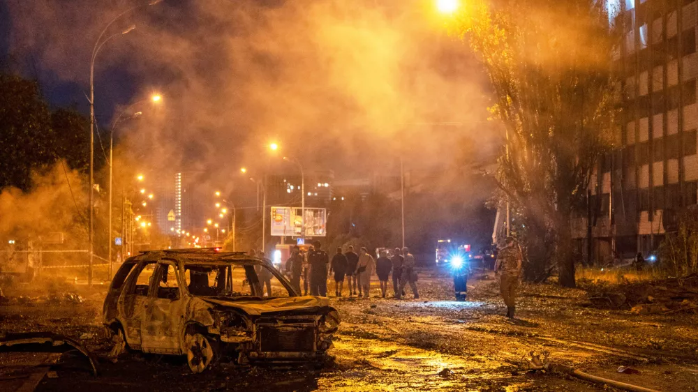 A burned car is seen after a Russian missile attack in Kyiv, Ukraine, Saturday, Aug. 1, 2026. (AP Photo/Dan Bashakov)