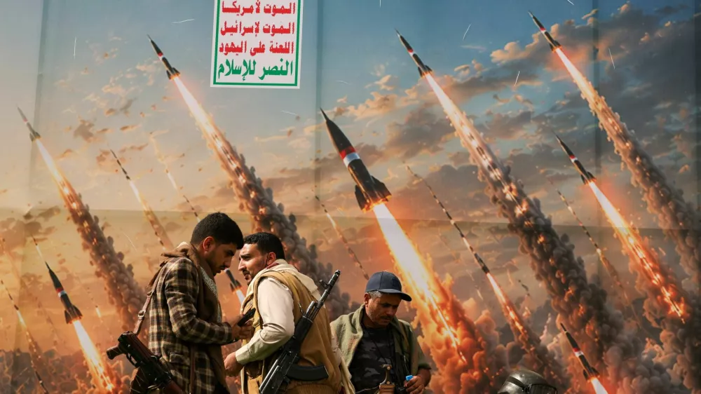 Houthi activists stand on a platform against a banner depicting Houthi missiles, at an anti-Saudi rally amid an escalation with the kingdom, in Sanaa, Yemen, July 31, 2026. REUTERS/Khaled Abdullah