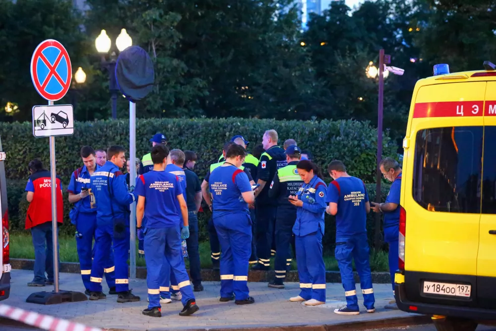 Paramedics gather near a deadly ​explosion at ​a ​restaurant in Moscow, Saturday, Aug. 1, 2026. (Sergei Vedyashkin/Moscow News Agency via AP)