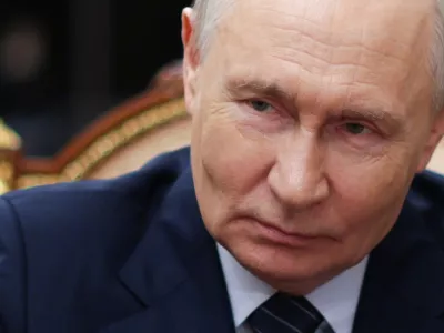Russian President Vladimir Putin listens to Russian Railways CEO Oleg Belozerov at the Kremlin in Moscow, Friday, July 31, 2026. (Alexander Kazakov/Sputnik, Kremlin Pool Photo via AP)