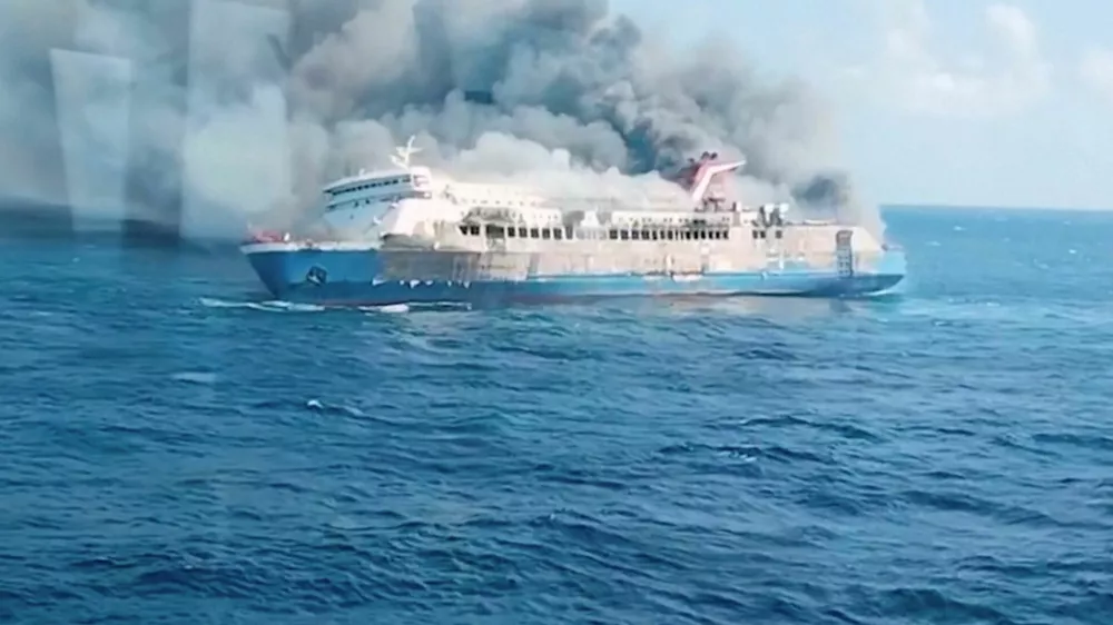 Plumes of smoke rise from a ferry which caught fire off Indonesia's Madura island, according to statement by the Indonesian search and rescue agency, in this screengrab obtained from a video, East Java province, Indonesia, August 2, 2026. National Search and Rescue Agency (BASARNAS)/Handout via REUTERS  ATTENTION EDITORS - THIS IMAGE HAS BEEN SUPPLIED BY A THIRD PARTY. MANDATORY CREDIT.
