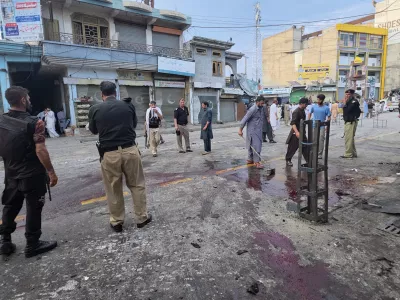 Police officers examine the site following a suicide bombing, in Kabal, a town in the Swat Valley in Pakistan's Khyber Pakhtunkhwa province, Sunday, Aug. 2, 2026. (AP Photo/Sherin Zada)