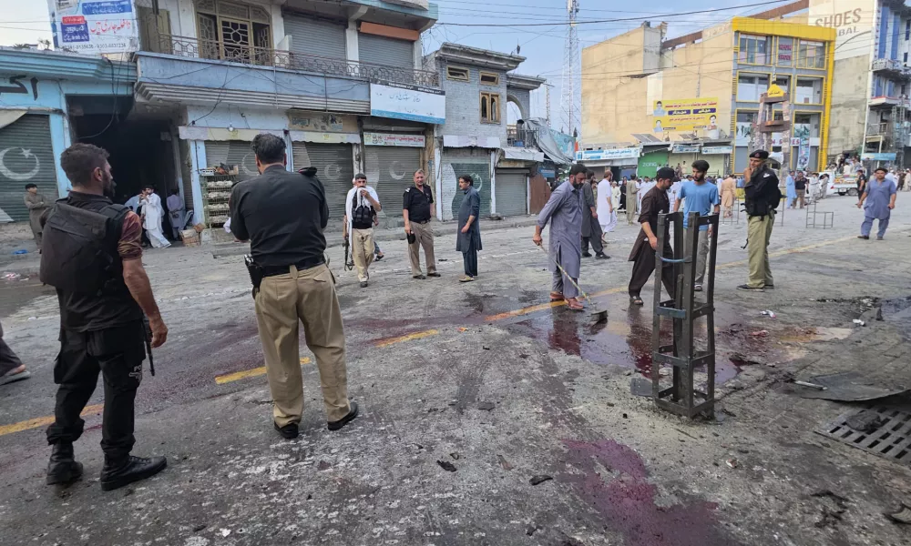 Police officers examine the site following a suicide bombing, in Kabal, a town in the Swat Valley in Pakistan's Khyber Pakhtunkhwa province, Sunday, Aug. 2, 2026. (AP Photo/Sherin Zada)