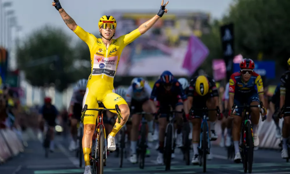 Netherlands' Lorena Wiebes of team SD Worx Protime celebrates crossing the finish line to win the second stage a 149 km from Aigle to Geneva during the Women's Tour de France (Tour de France Femmes), in Geneva, Switzerland, Sunday, Aug. 2, 2026. (Jean-Christophe Bott/Keystone via AP)