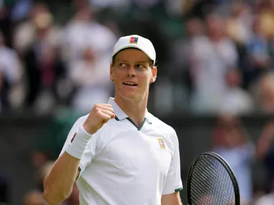 Jannik Sinner of Italy celebrates winning the men's singles match against Miomir Kecmanovic of Serbia during at the Wimbledon Tennis Championships in London, Monday, June 29, 2026.(AP Photo/Kin Cheung)