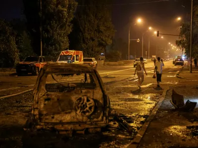 Residents leave the site of a Russian missile strike, amid Russia's attack on Ukraine, in Kyiv region, Ukraine August 1, 2026. REUTERS/Anatolii Stepanov