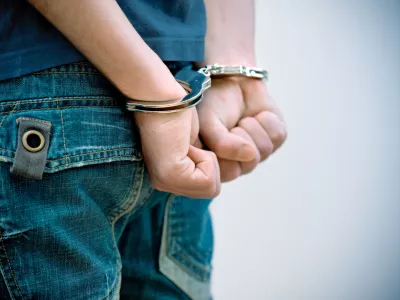 Young man in handcuffs