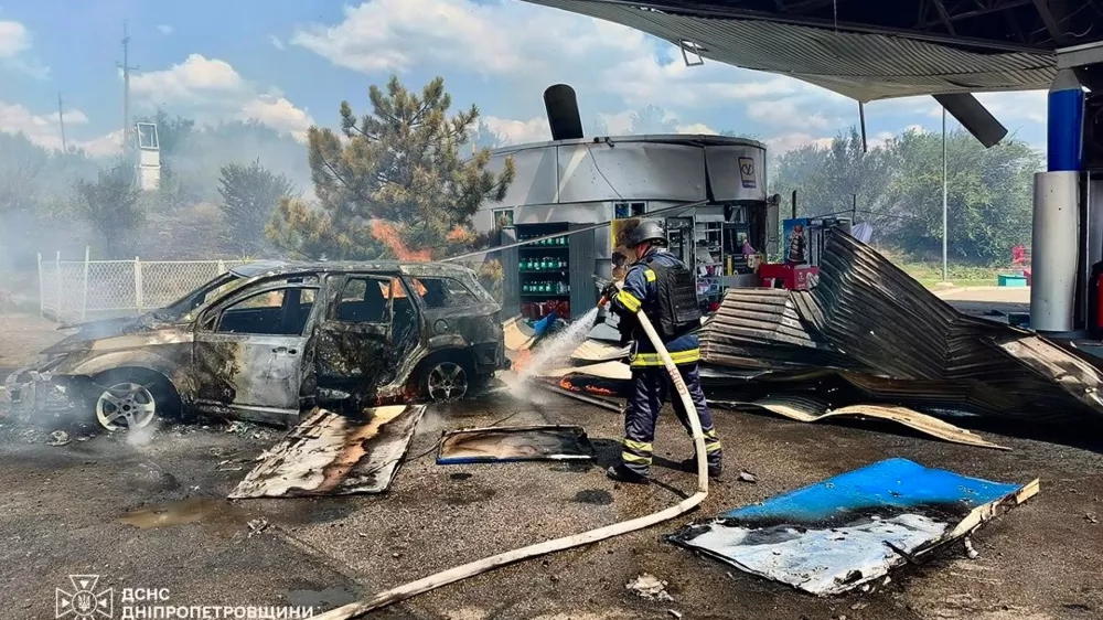 In this photo provided by the Ukrainian Emergency Service, firefighters put out a fire at a gas station following a Russian drone attack in Dnipropetrovsk region, Ukraine, Monday, Aug. 3, 2026. (Ukrainian Emergency Service via AP)