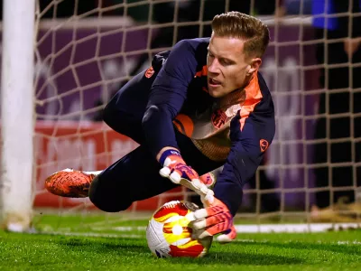FILE - Barcelona's goalkeeper Marc-Andre ter Stegen warms up prior to the start of the Copa del Rey soccer match between Guadalajara and Barcelona in Guadalajara, Spain, Dec. 16, 2025. (AP Photo/Rudy Garcia, File)