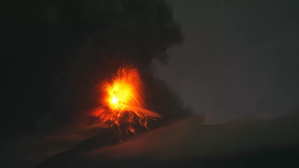 Lava flows and clouds of ash out of the crater of the Fuego Volcano, as seen from San Juan Alotenango, Guatemala, Tuesday, Aug. 4, 2026. (AP Photo/Moises Castillo)