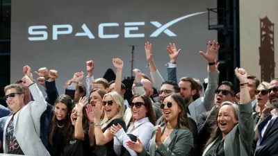 FILE PHOTO: SpaceX leadership members and guests celebrate on a balcony at the Nasdaq MarketSite on the day of SpaceX's initial public offering (IPO), in New York City, U.S., June 12, 2026. REUTERS/Brendan McDermid/File Photo