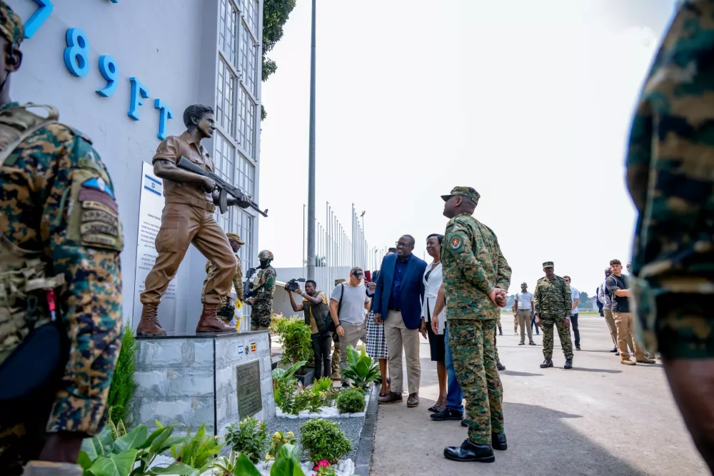 Uganda's military chief, Gen. Muhoozi Kainerugaba unveils a monument honoring the late Yoni Netanyahu, brother of Israeli Prime Minister Benjamin Netanyahu, at the old terminal of Entebbe International Airport in Entebbe, Uganda, Saturday, Aug. 1, 2026. (Uganda People's Defence Forces Press Service via AP)