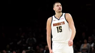 Denver Nuggets center Nikola Jokic (15) looks on during the second half of Game 6 of a first-round NBA basketball playoffs series against the Minnesota Timberwolves, Thursday, April 30, 2026, in Minneapolis. (AP Photo/Matt Krohn)