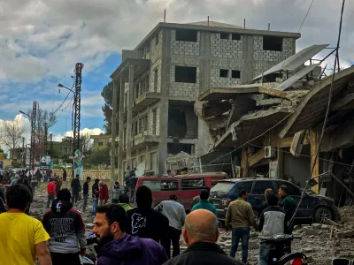 22 March 2025, Lebanon, Touline: Lebanese people inspect destruction of a building that was targeted in an Israeli air strike in the southern Lebanese village of Touline. Photo: STR/dpa