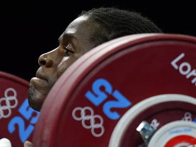 Cameroon's Madias Dodo Nzesso Ngake competes in the women's 75kg group B weightlifting event during the London 2012 Olympic Games at The Excel Centre in London on August 3, 2012.,Image: 139188005, License: Rights-managed, Restrictions:, Model Release: no 