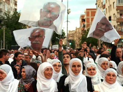 Supporters of the pro-Kurdish Peoples' Equality and Democracy Party (DEM Party) carry flags bearing an image of jailed Kurdish militant leader Abdullah Ocalan during a rally in Diyarbakir, Turkey, May 16, 2026. REUTERS/Sertac Kayar