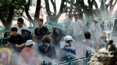 Visitors walk through a cooling mist system at Gwangmyeong Cave during a record-breaking heatwave in Gwangmyeong, South Korea, August 5, 2026, after Yangsan recorded the highest temperature in the country in 122 years of weather observations on Sunday. REUTERS/Kim Soo-hyeon   TPX IMAGES OF THE DAY