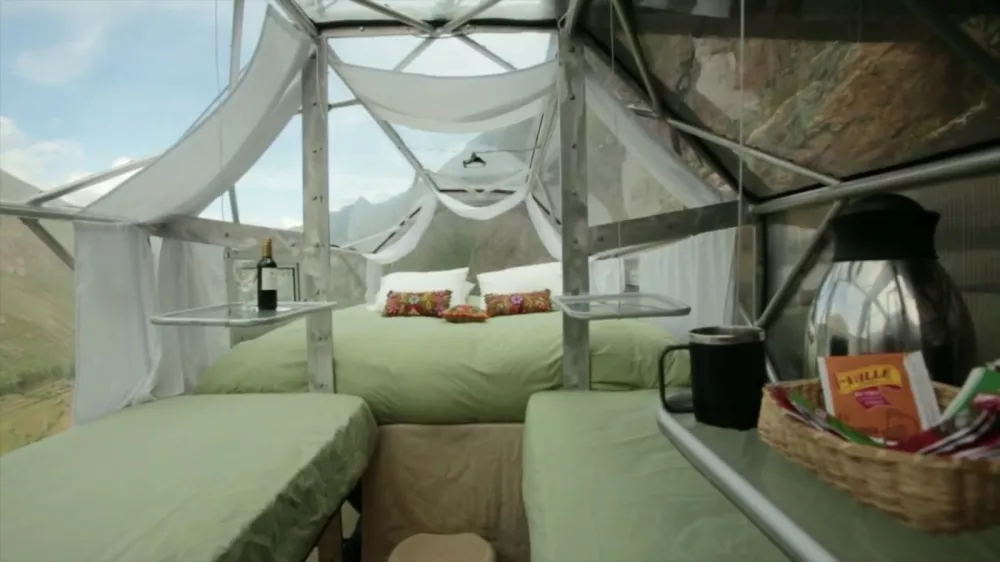 Ferrari Press AgencyRef 6646Tents 1	17/7/15See Ferrari picturePicture credit: Natura Vive SkylodgeHere some terrifying holiday accommodation where people are happy to pay to hang around all night.The Natura Vive Skylodge in Peru consists of three pods suspended 400 ft / 130 metres from a cliff.It is made up of three clear capsules hanging from a cliff in Sacred Valley. Each suite comes complete with four beds, dining and a private bathroom separated from the bedroom, with ecological toilet and sink. The completely transparent pod is made using aerospace aluminum and weather resistant polycarbonate and offers 300-degree vistas of the stunning Sacred Valley. Guests sleep on high quality mattresses, cotton sheets, down pillows and quilts. The one-night package also includes breakfast and a gourmet dinner with wine. The pods come fitted with six windows and four ventilation ducts.Safety measures include an exit portal located in the upper part of each pod so thgere's no chance of rolling out in the middle of the night.Each pod also has curtains for ensuracing privacy.Those brave enough to sleep a night in a Natura Vive Skylodge Adventure must climb the cliff using a Via Ferrata or hike an intrepid trail through ziplines. This cliff-hanging experience complete with climb and zip-lining costs $312 USD / &pound;200 GBP / &euro;280 Euros.OPS: Natura Vive Skylodge in Sacred Valley, Peru.Picture supplied by Ferrari,Image: 253150456, License: Rights-managed, Restrictions:, Model Release: no 