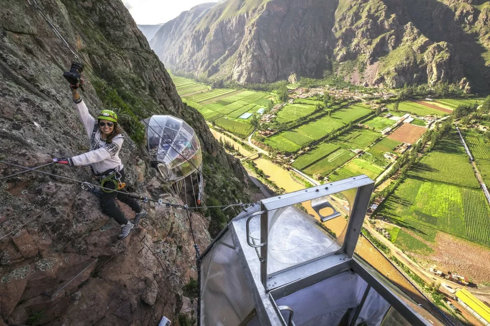 This is the worlds first hanging lodge suspended 1,200ft off the ground in Perus Sacred Valley of Cusco.Boasting stunning panoramic views, the Skylodge Adventure Suites capsules can fit up to eight people and each of the three luxurious cabins come complete with four beds, a dinning area and a private bathroom with an ecological toilet.Intrepid travelers have to climb the mountain to get to the capsule, via a secure climbing path which is fit for beginners, and are rewarded with 300 degree view of the majestic Sacred Valley once at the top.Measuring 24ft in length and 8ft in height and width, the pods are hand crafted out of aerospace aluminum and weather resistant polycarbonate.It costs around USD$450 per person for a nights stay, and the price includes a sunrise breakfast enjoyed from the comfort of your personal capsule, as well as a gourmet dinner served up with wine.At the end of the stay, guests get back down the mountain via one of seven zip lines.Skylodge Adventure Suites became the worlds first hanging lodges after launching in June 2013. It was opened by a small company called Natura Vive, a group of young entrepreneurs whose philosophy was to create a mountain experience that people of all ages and abilities can enjoy.29 Jan 2018Pictured: Skylodge Adventure Suites are comprised of three luxurious cabins which hang 1,200ft in the air on a mountainside in Perus Sacred Valley of Cusco.,Image: 361729215, License: Rights-managed, Restrictions: World Rights, Model Release: no, Pictured: Skylodge Adventure Suites are comprised of three luxurious cabins which hang 1,200ft in the air on a mountainside in Perus Sacred Valley of Cusco 