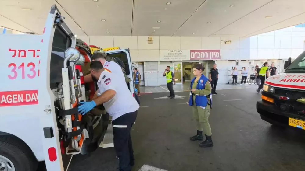 Paramedics work to move an Israeli casualty from inside an ambulance, after being wounded in an explosion in Lebanon, at Rambam Health Care Campus in Haifa, Israel, August 5, 2026. Rambam Health Care Campus/Handout via REUTERS  THIS IMAGE HAS BEEN SUPPLIED BY A THIRD PARTY Verification Lines: Reuters was able to confirm the location of the video from heliport, roundabout, buildings and signage which matched archive and satellite imagery of the area. Date was confirmed by Rambam hospital's spokesperson.