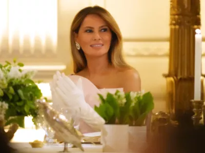 First lady Melania Trump listens as President Donald Trump speaks during a State Dinner with Britain's King Charles III and Queen Camilla in the East Room of the White House State Dinner Tuesday, April 28, 2026, in Washington. (AP Photo/Alex Brandon)