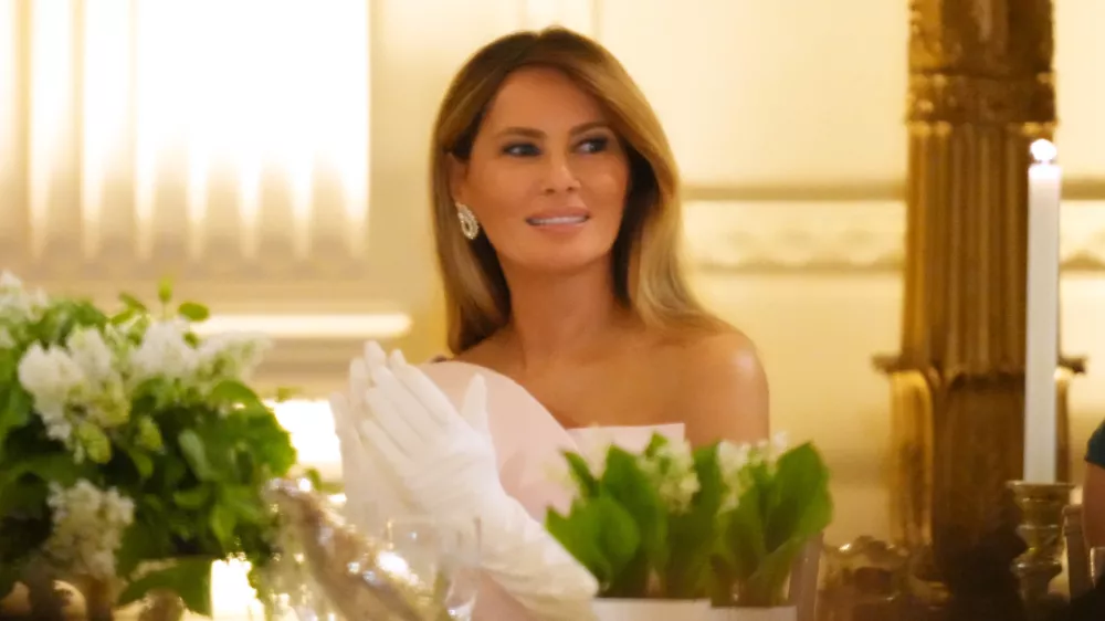 First lady Melania Trump listens as President Donald Trump speaks during a State Dinner with Britain's King Charles III and Queen Camilla in the East Room of the White House State Dinner Tuesday, April 28, 2026, in Washington. (AP Photo/Alex Brandon)