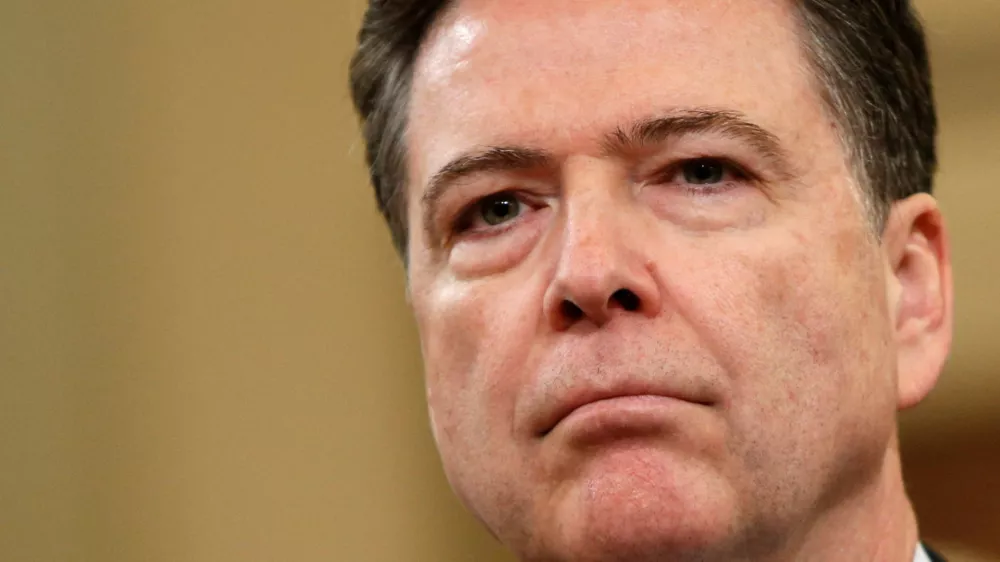 FILE PHOTO: FBI Director James Comey waits before testifying at a House Intelligence Committee hearing into alleged Russian meddling in the 2016 U.S. election, on Capitol Hill in Washington, U.S., March 20, 2017. REUTERS/Joshua Roberts/File Photo