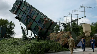 FILE PHOTO: Ukrainian service members walk next to a launcher of a Patriot air defence system, amid Russia's attack on Ukraine, in an undisclosed location, Ukraine August 4, 2024. REUTERS/Valentyn Ogirenko/File Photo/File Photo