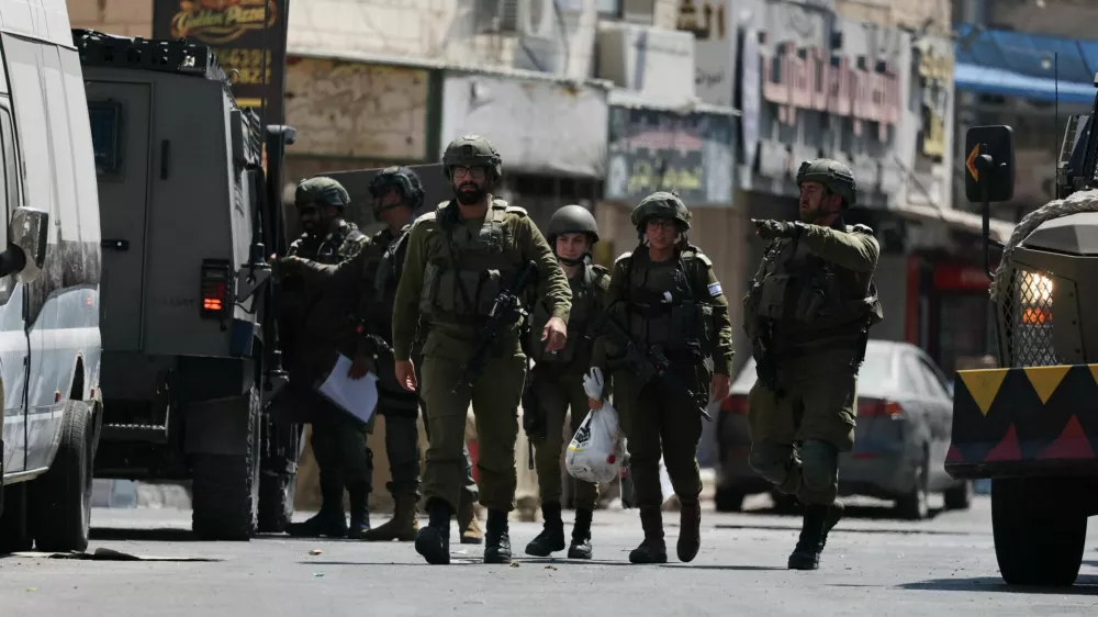 Israeli forces take part in a raid in Qalandia refugee camp, in the Israeli-occupied West Bank, August 6, 2026. REUTERS/Ammar Awad