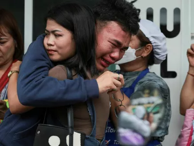 A student reacts after evacuating from Debsirin Nonthaburi School, following a shooting incident at the school, in Bang Kruai district in Nonthaburi province on the outskirts of Bangkok, Thailand, August 7, 2026. REUTERS/Chalinee Thirasupa